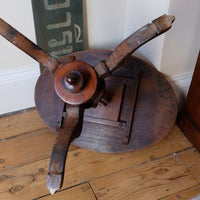 underneath of a Late Victorian mahogany oval tilt-top tripod table with open reed column detail