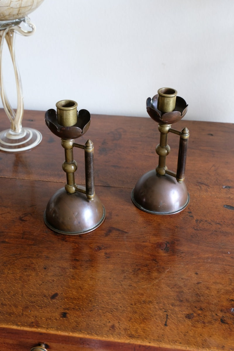 Arts & Crafts copper and brass candlestick pair with patina