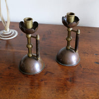 Arts & Crafts copper and brass candlestick pair with patina