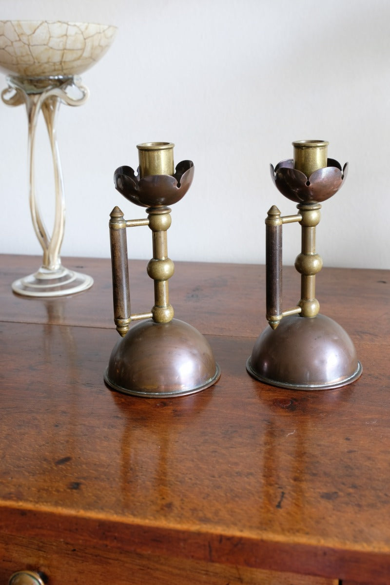 Arts & Crafts copper and brass candlestick pair with patina