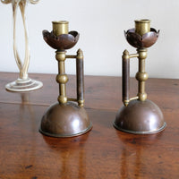 Arts & Crafts copper and brass candlestick pair with patina