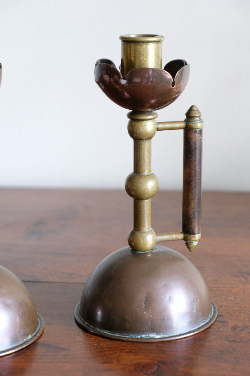 Arts & Crafts copper and brass candlestick pair with patina