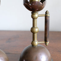 Arts & Crafts copper and brass candlestick pair with patina