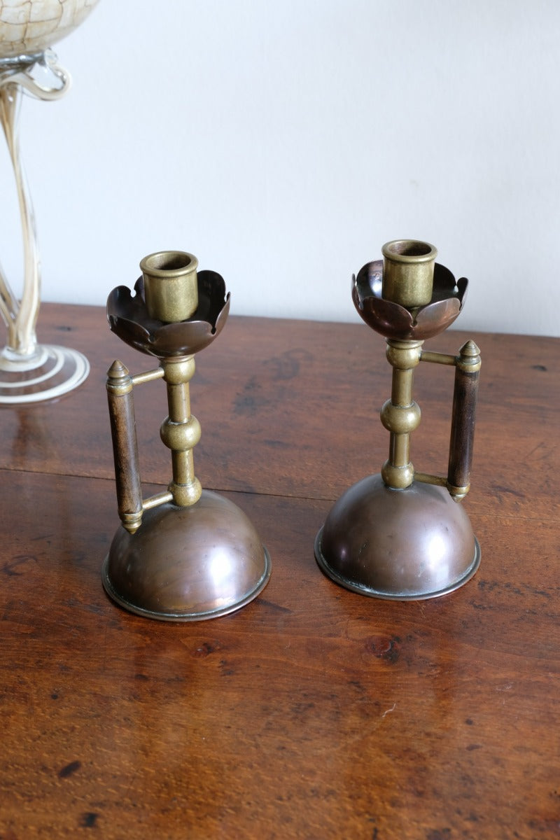 Arts & Crafts copper and brass candlestick pair with patina