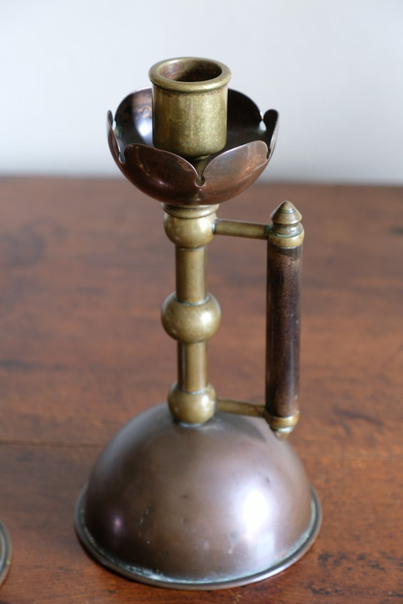 Arts & Crafts copper and brass candlestick pair with patina
