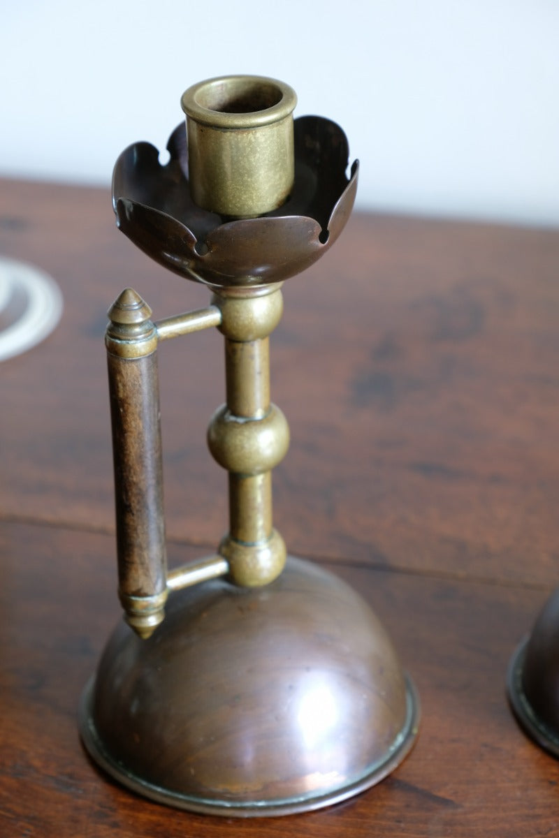 Arts & Crafts copper and brass candlestick pair with patina