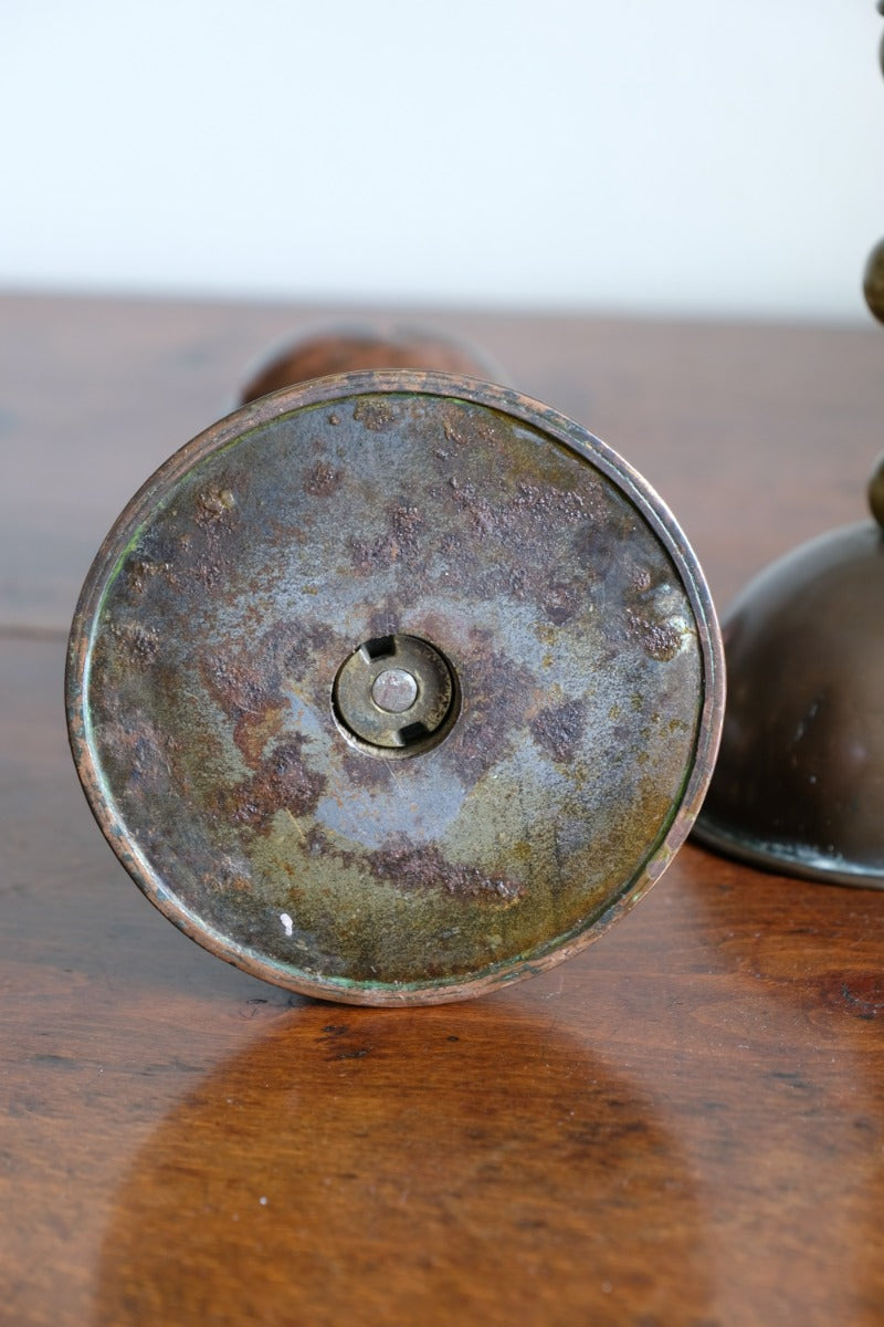 Arts & Crafts copper and brass candlestick pair with patina