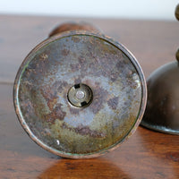 Arts & Crafts copper and brass candlestick pair with patina