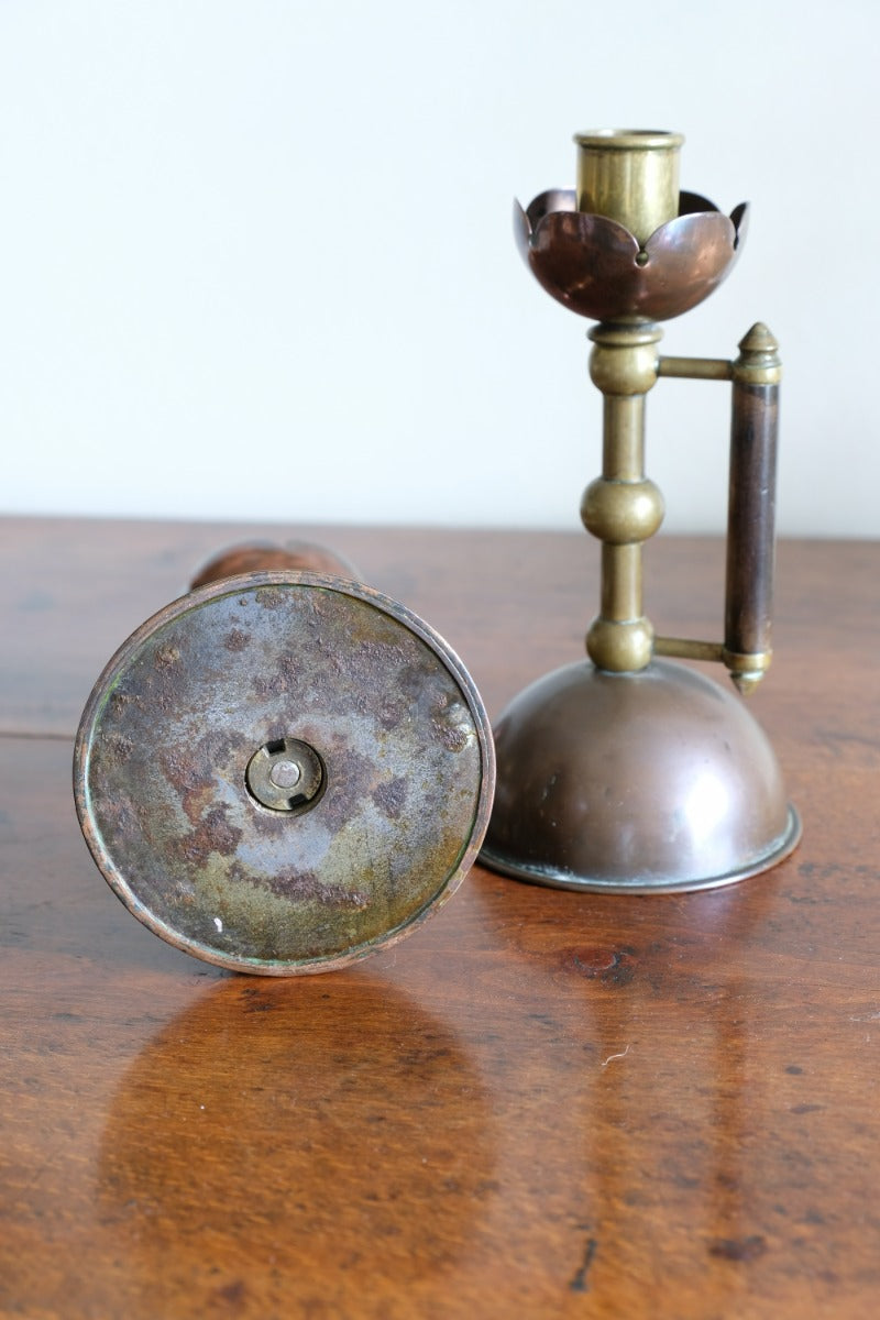 Arts & Crafts copper and brass candlestick pair with patina