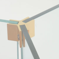 Modern glass hall table with sculptural metal V-shaped base in Leon Rosen style