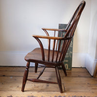 Side view- Antique English Windsor armchair in elm with uneven seat and ash stick back