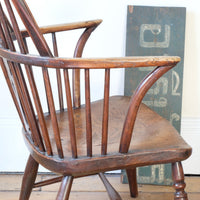 arm close up - Antique English Windsor armchair in elm with uneven seat and ash stick back