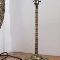 Arts & Crafts brass table lamp with hendecagon base and flexible stem, circa 1900–1920