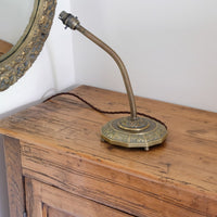 Arts & Crafts brass table lamp with hendecagon base and flexible stem, circa 1900–1920