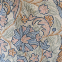 close up of a William Morris inspired Arts and Crafts chain stitch tapestry wall hanging textile panel