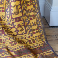 Antique Anatolian kilim rug with saffron ground and geometric motifs
