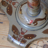 Tripod base of a Pair of antique chinoiserie lacquered pedestal side tables with hand painted oriental scenes and gilt detailing