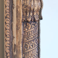 Close up detail o large antique Indian carved hardwood mirror with Indo-Islamic Moorish arch detail a