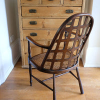 Back view on a Rare Edwardian bentwood lattice back armchair attributed to Jas Shoolbred with pierced Arts & Crafts design