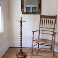 Rare Victorian walnut barley twist candle and wine stand with brass sconce and carved foliate decoration, circa 1870