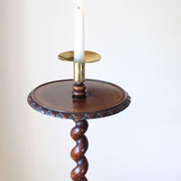 View of the table top and brass candle sconce on a Rare Victorian walnut barley twist candle and wine stand with brass candle sconce and carved foliate decoration, circa 1870