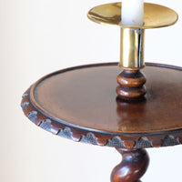 Close up shot of the tabletop edge on a Rare Victorian walnut barley twist candle and wine stand with brass candle sconce and carved foliate decoration, circa 1870