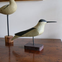hand carved monochrome painted decorative bird front view