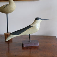 hand carved monochrome painted decorative bird front view