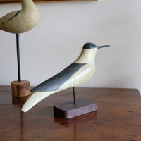 hand carved monochrome painted decorative bird front view