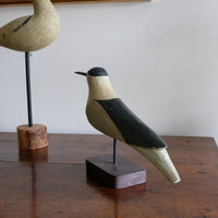 hand carved monochrome painted decorative bird front view