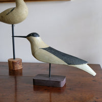 hand carved monochrome painted decorative bird front view