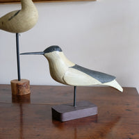 hand carved monochrome painted decorative bird front view
