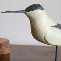 hand carved monochrome painted decorative bird front view