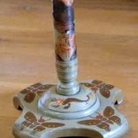 Close‑up gold butterfly feet detail on Chinoiserie pedestal table