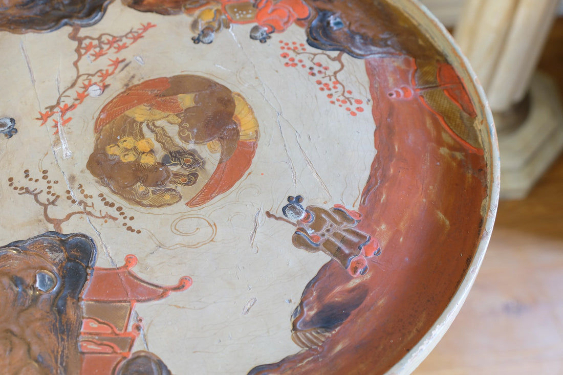 Individual hand‑painted relief landscape scene on Chinoiserie table top