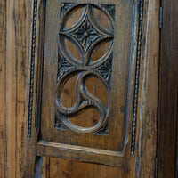 Intricate circular pierced backrest of elm hall chair