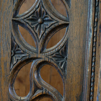 Intricate circular pierced backrest of elm hall chair