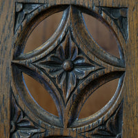 Intricate circular pierced backrest of elm hall chair