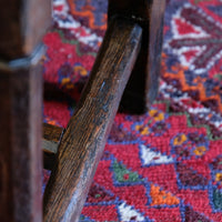 Turned and block legs with H‑stretcher on antique elm chair