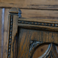 Turned and block legs with H‑stretcher on antique elm chair