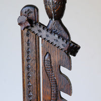 Chip carved detail on a Rare Arts & Crafts Carved Oak Ratchet Adjustable Candle Stand