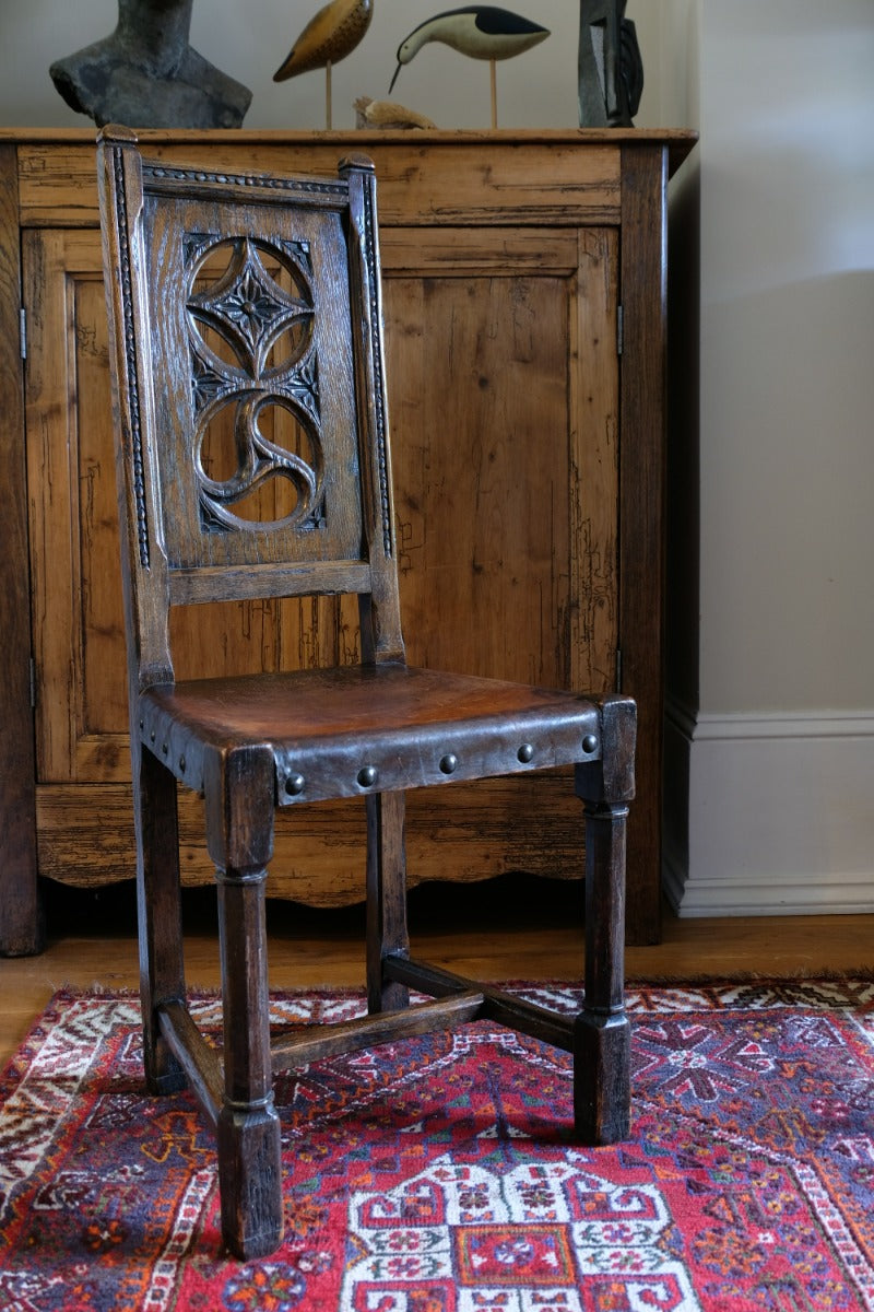 Turned and block legs with H‑stretcher on antique elm chair