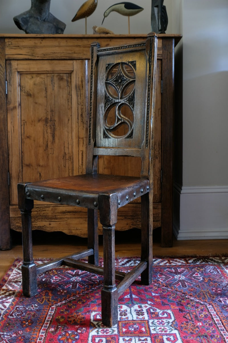 Turned and block legs with H‑stretcher on antique elm chair