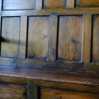 close up pf the back panel and rest - 19th Century Welsh Oak Settle Bench with Painted Panels and Storage Chest19th Century Welsh Oak Settle Bench with Painted Panels and Storage Chest