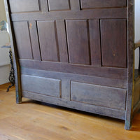 back panel raised and fielded construction of the 19th Century Welsh Oak Settle Bench with Painted Panels and Storage Chest