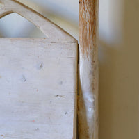 Close up of the worn back post on a 19th Century Gothic Painted Pine Hall Bench with Gothic Fretwork and Original Painted Finish