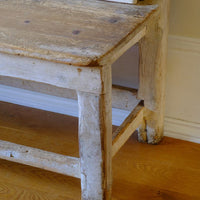 Corner leg and worn seat shot on a 19th Century Gothic Painted Pine Hall Bench with Gothic Fretwork and Original Painted Finish