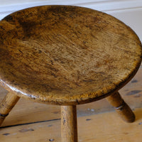 Dished trop on an Early 19th Century Vernacular Three Legged Sycamore Dairy Stool with Dished Seat