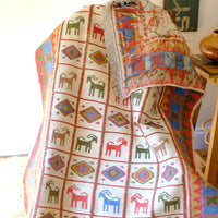Traditional Persian Sumak wool flatweave rug with repeating goat motifs and geometric design