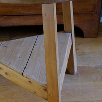close up of the triangular under tier shelf on a 19th Century Pine Cricket Supper Table for Two with Triangular Under-Tier Shelf